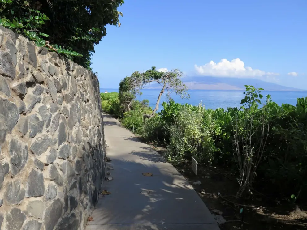 A rock wall provides some shade in the morning. Island with clouds perfectly situated atop.