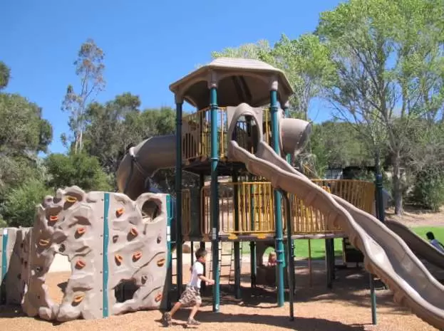 The play structure has three levels and is crazy high!