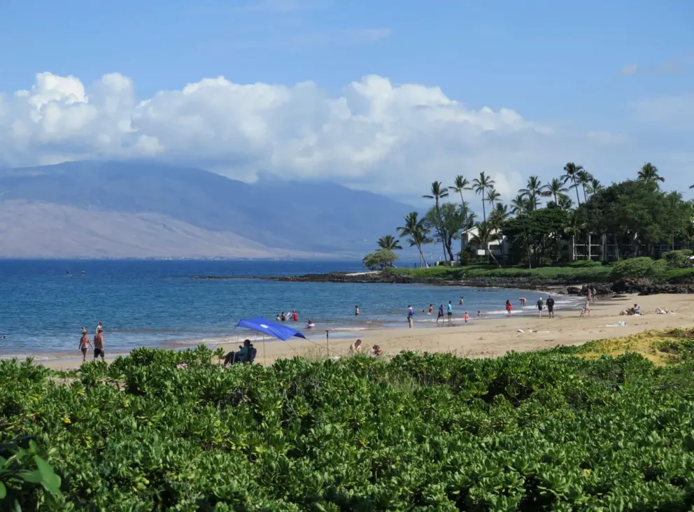 Wailea Beach has good views of West Maui and the clouds that gather above.