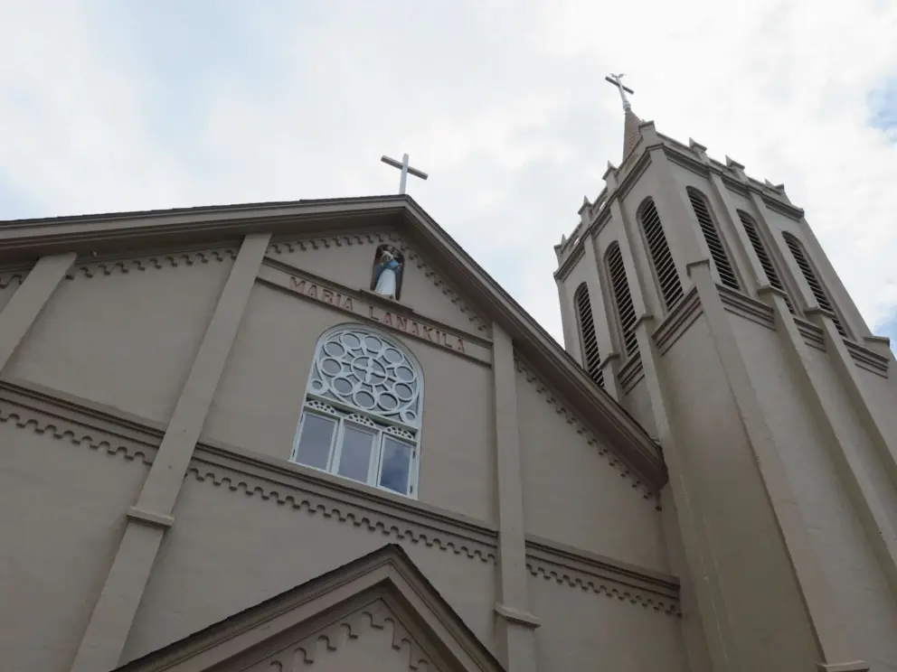 The rose window and church spire. 