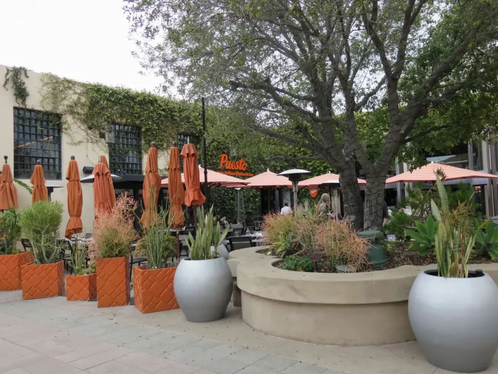 Silver and orange pots at Puesto. 