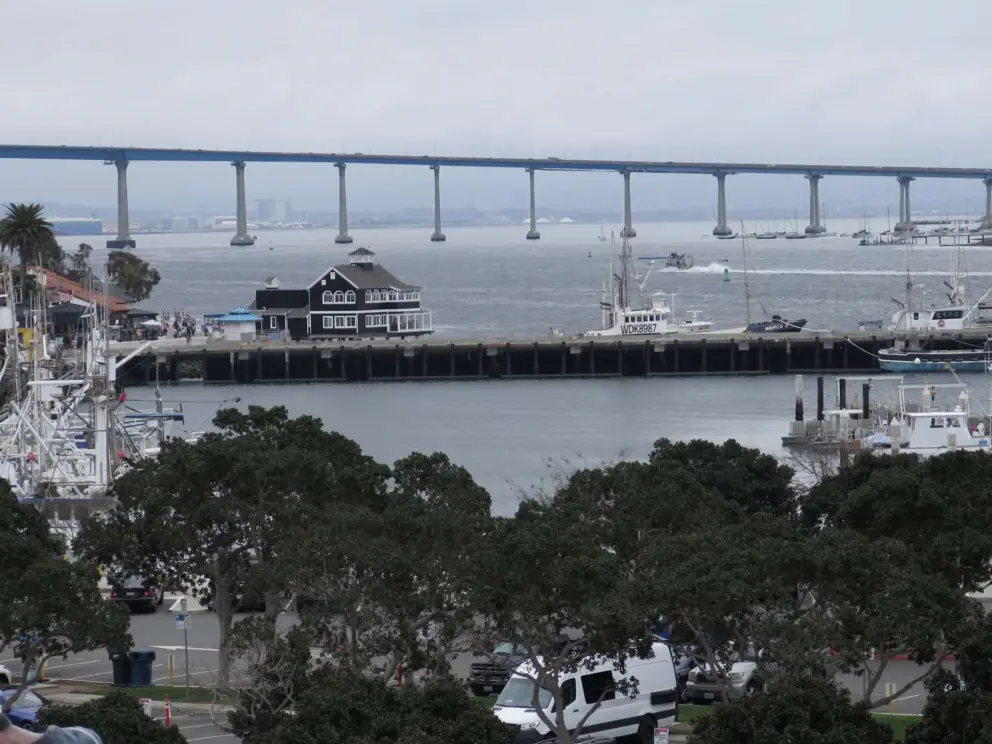 The blue house at Seaport Village, with Coronado Bridge views. 
