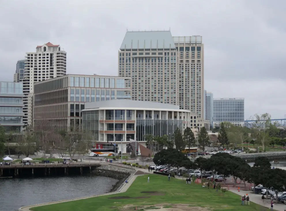 Manchester Grand Hyatt two towers with flying buttresses and Tuna Harbor Park, along the Embarcadero.