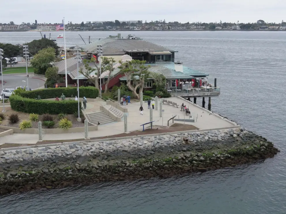 Statues of Bob Hope entertaining the troops and Fish Market Restaurant, in Tuna Harbor Park, along the Embarcadero. 