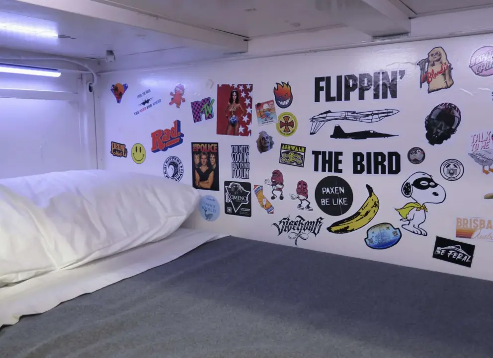 A bunk bed decorated with stickers. 