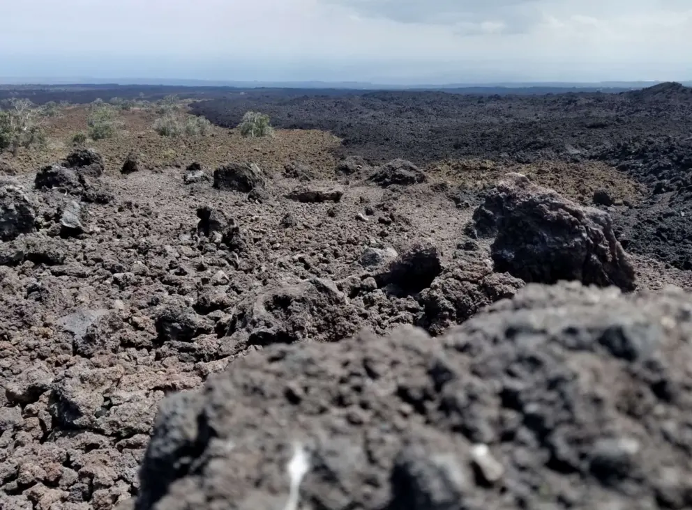 Different colors from different lava flows. 