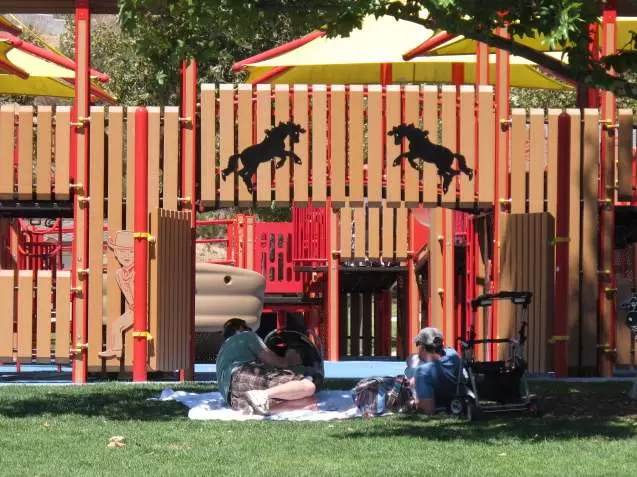 Beautiful wooden bridge and wild west horses.