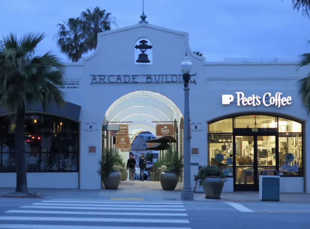The Arcade Building and Peet's Coffee, at night. 