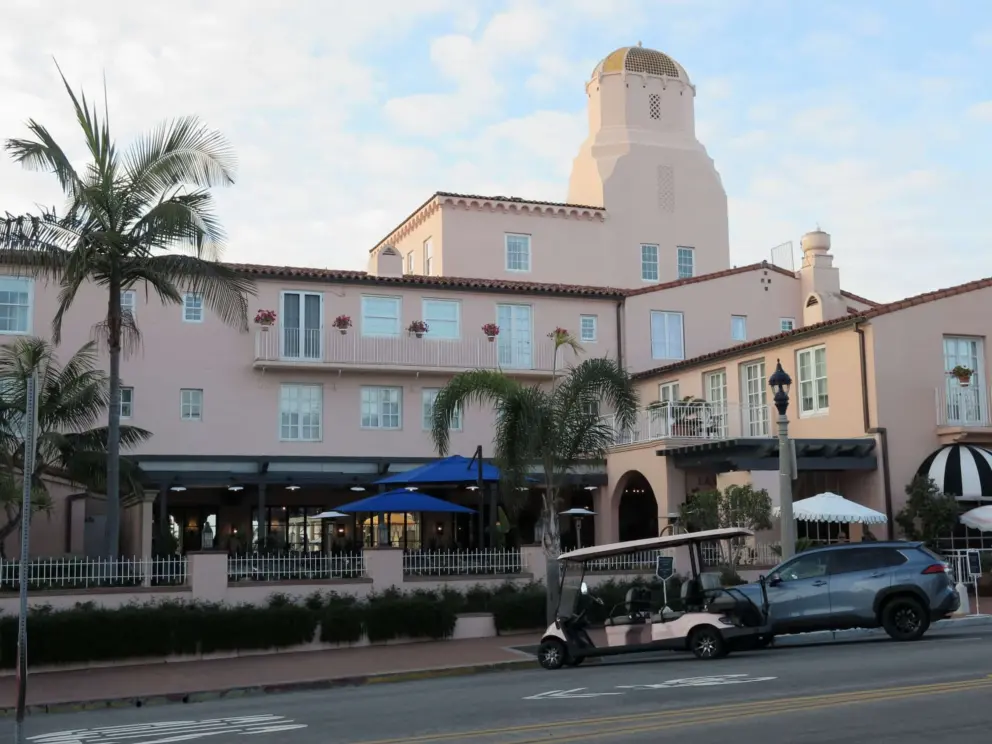 Peachy building with a tower. 