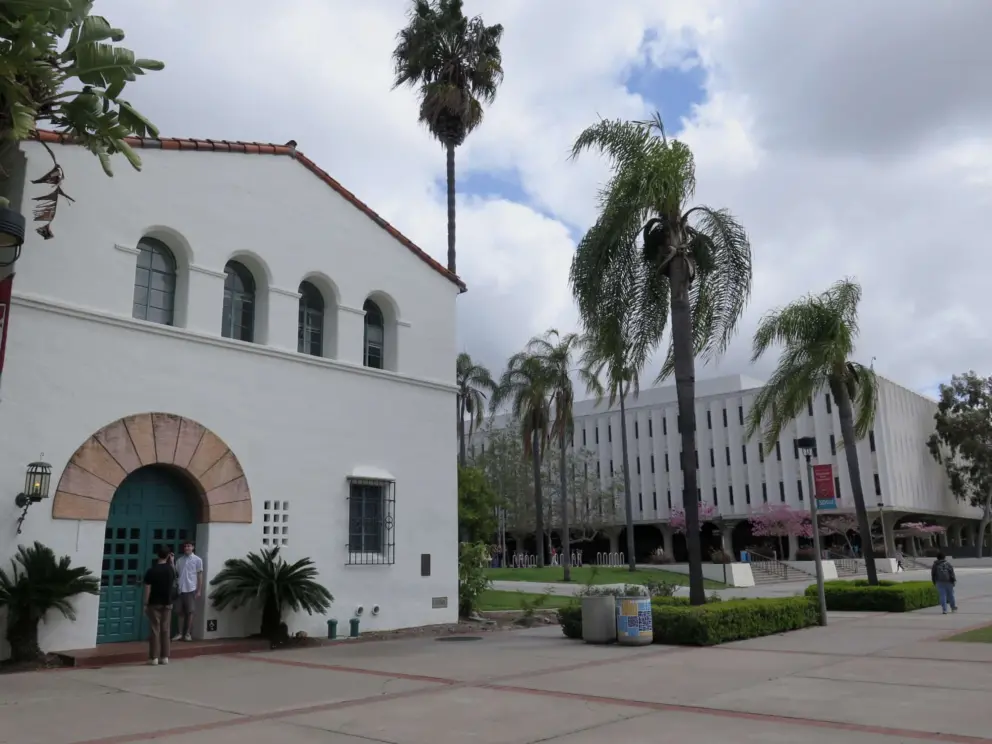 A Spanish building and a plain building. 