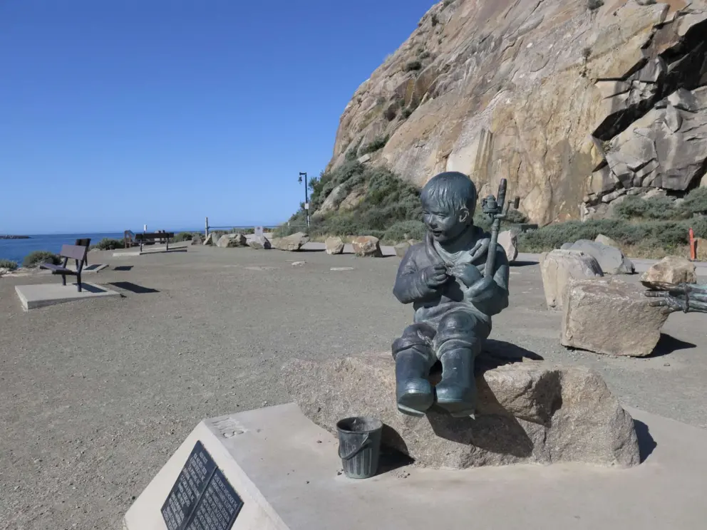 Fisherman's Family sculpture on the sunny sheltered side of Morro Rock. 