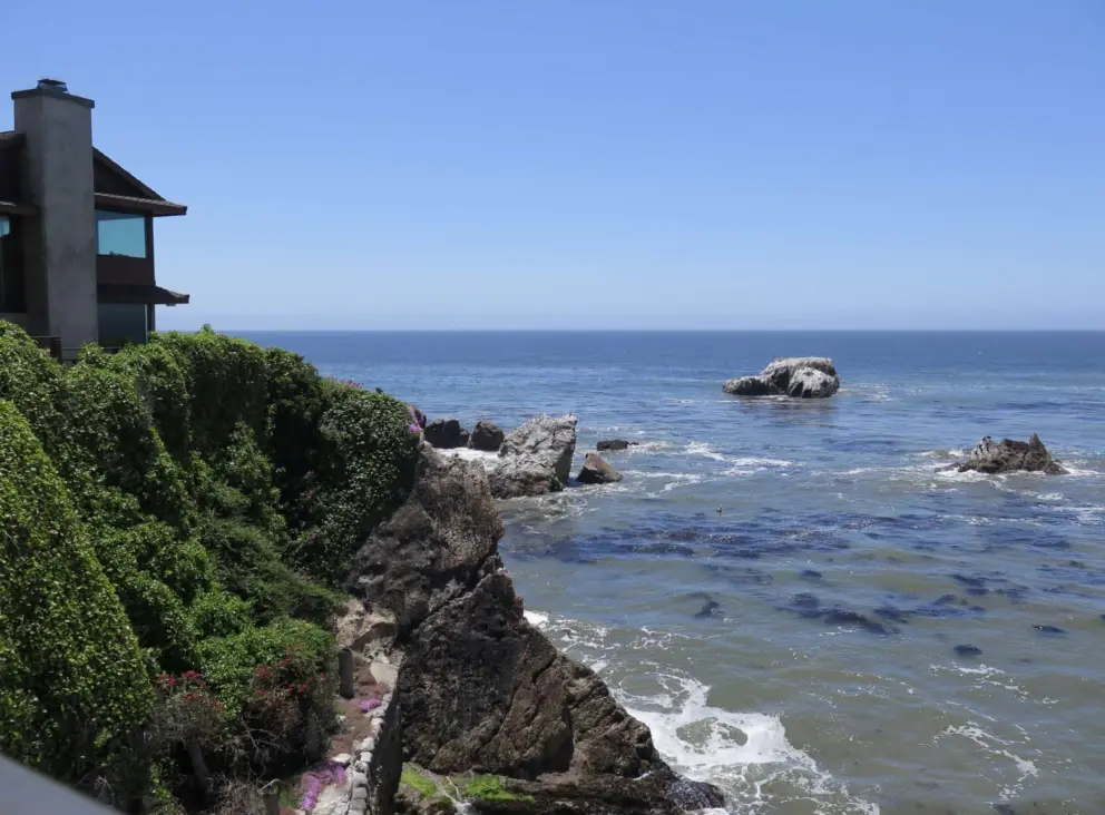 Bird rocks off the shore.