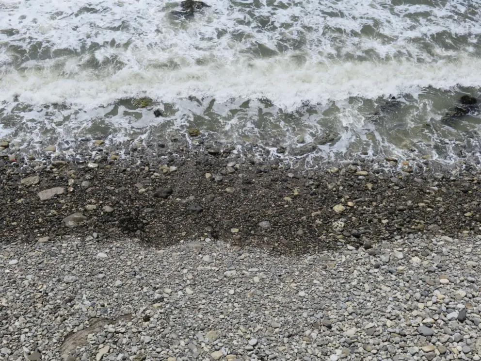 Listen to the sound of the big pebbles rolling in the waves!