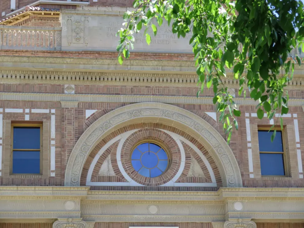The City Hall's round window reflecting the sky. 