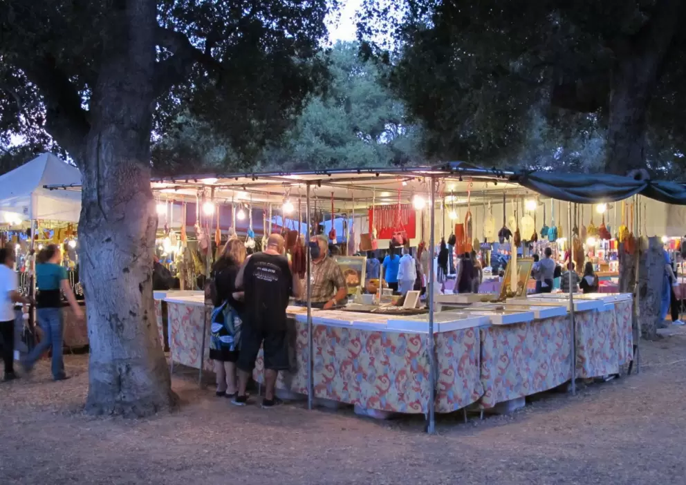 Booth under a big tree.