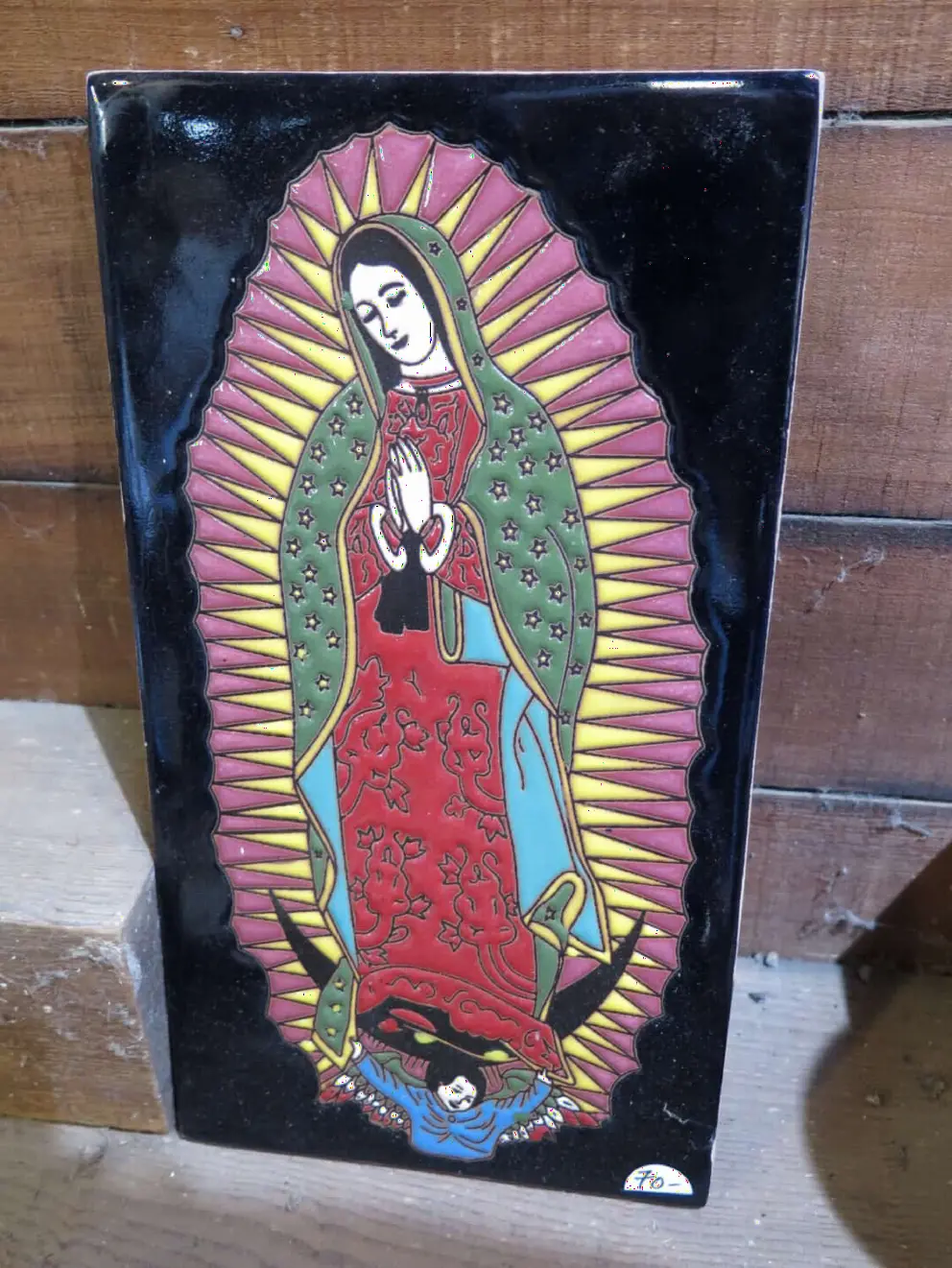 Our Lady of Guadalupe tilework in the pottery store. 