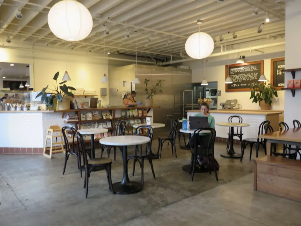 Seating with lanterns inside Companion Bakeshop. 