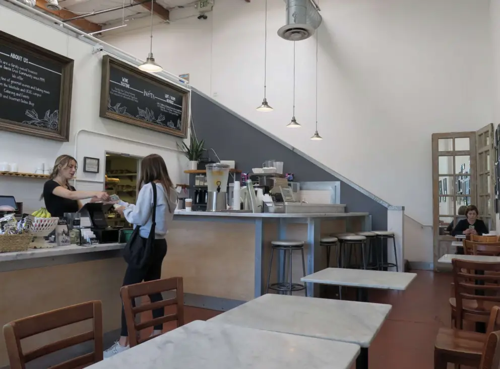 Seating inside Iveta Westside. Wooden chairs are more comfortable than cold metal ones!
