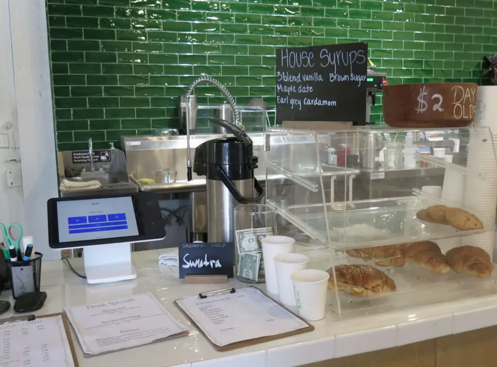 Green brick wall in the coffee shop.