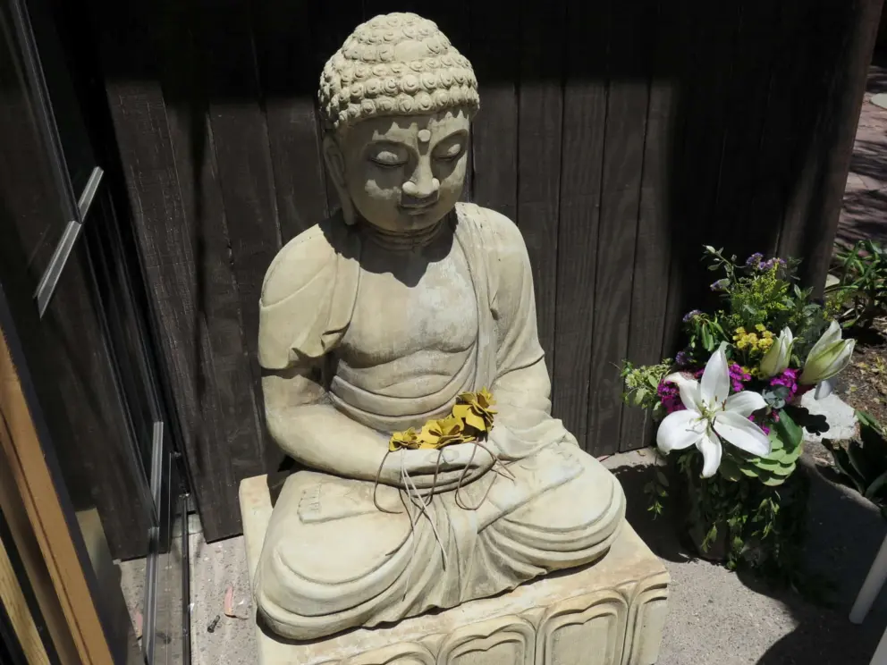 Leather flowers on a Buddhist sculpture. 