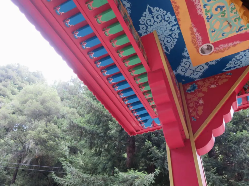 The painted ceiling above the first prayer wheel. 