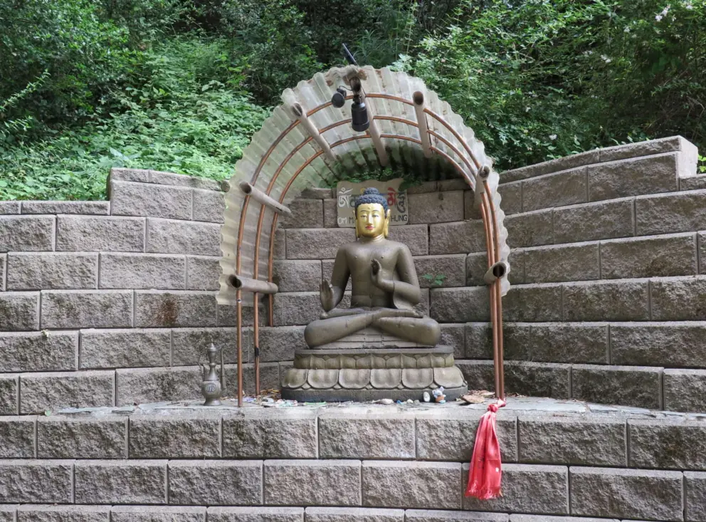 Statue on an elevated brick area. 