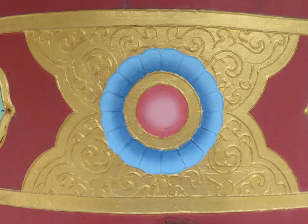 Prayer wheel gold-embossed decoration. 