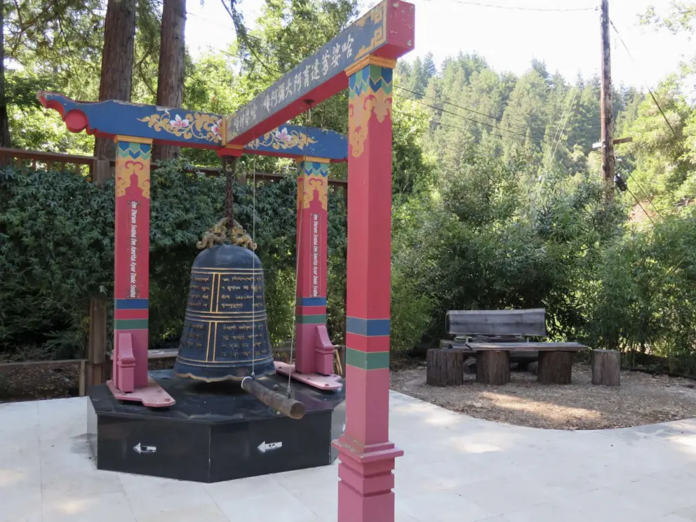 A bell you ring by pulling back the bar and letting it swing toward the bell. 