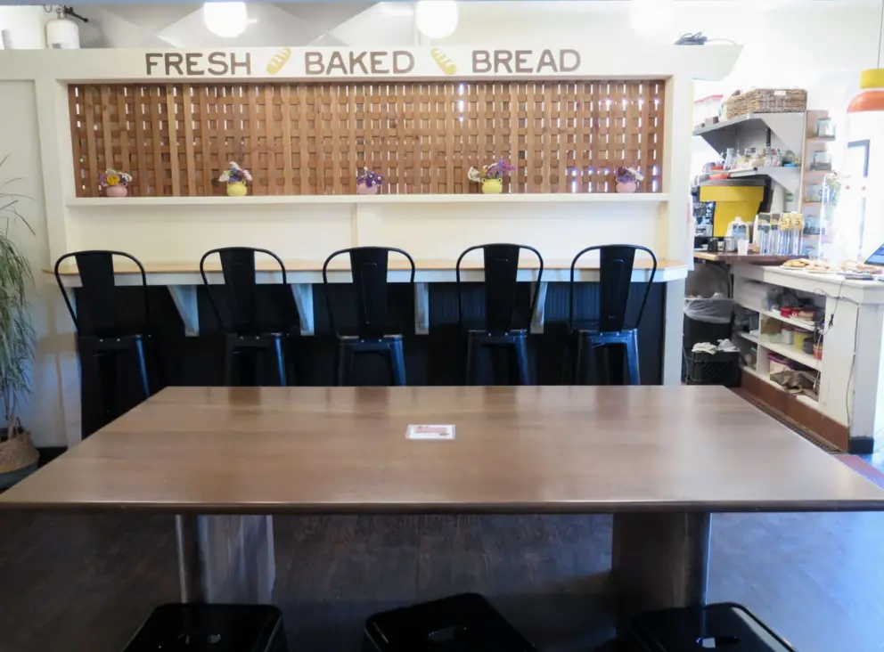 Large table inside The Grove Bakery and Cafe.