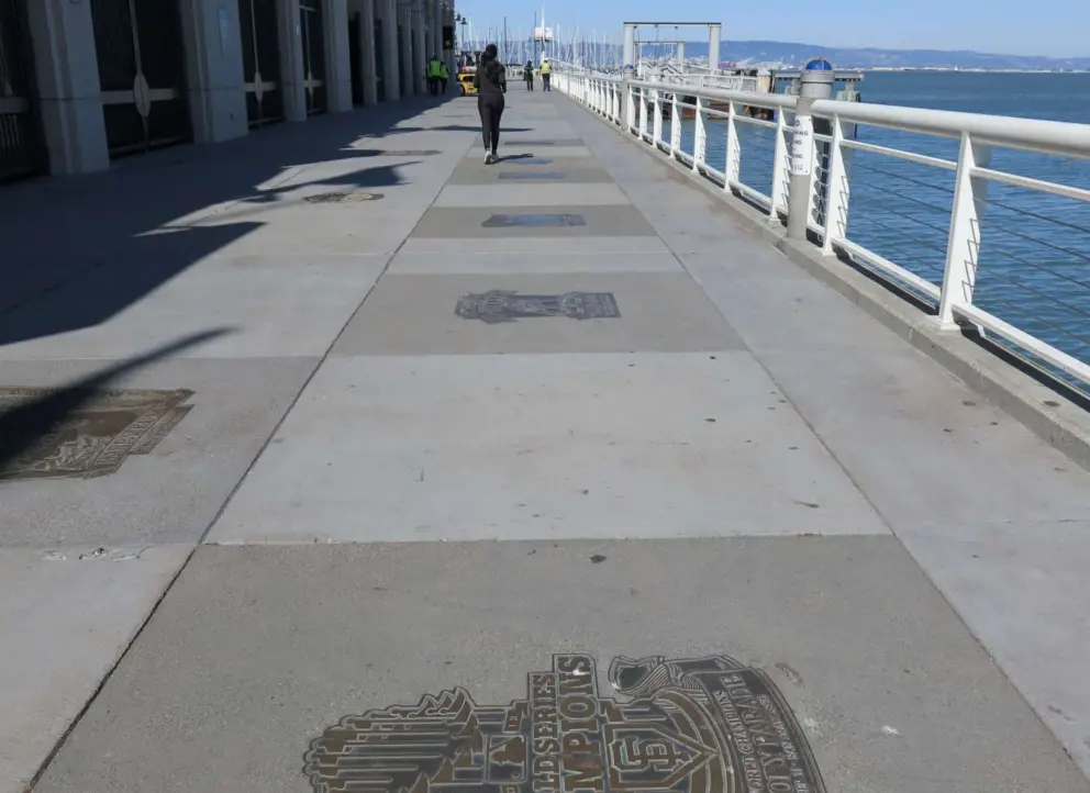 Plaques and waterfront path, at Oracle Park Stadium.
