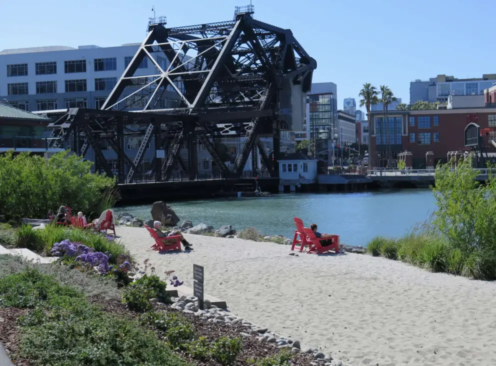 Adirondack chairs at the sandy area in China Basin Park, near 3rd Street Bridge. 