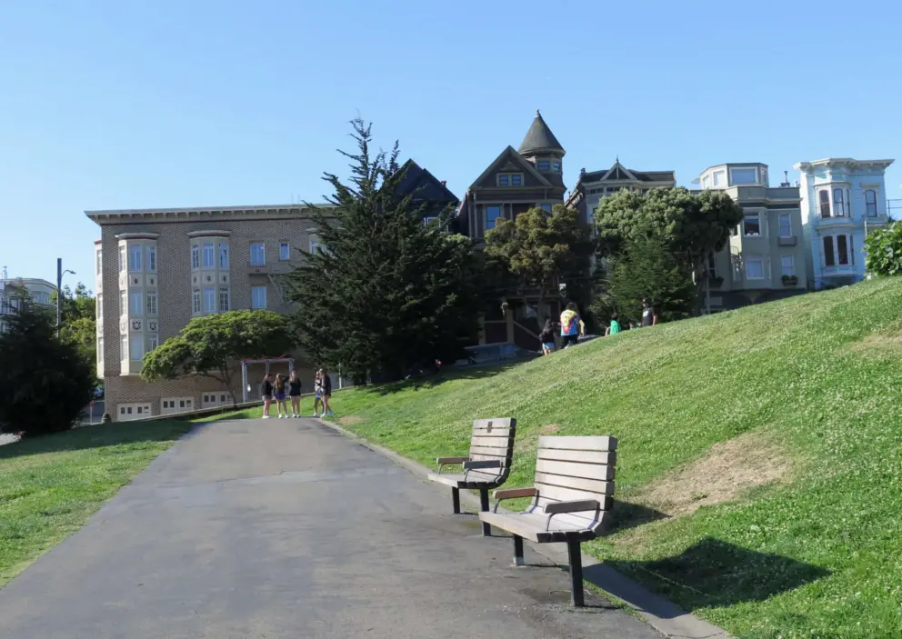 Benches at Alamo Square, with lovely houses in the distance. 