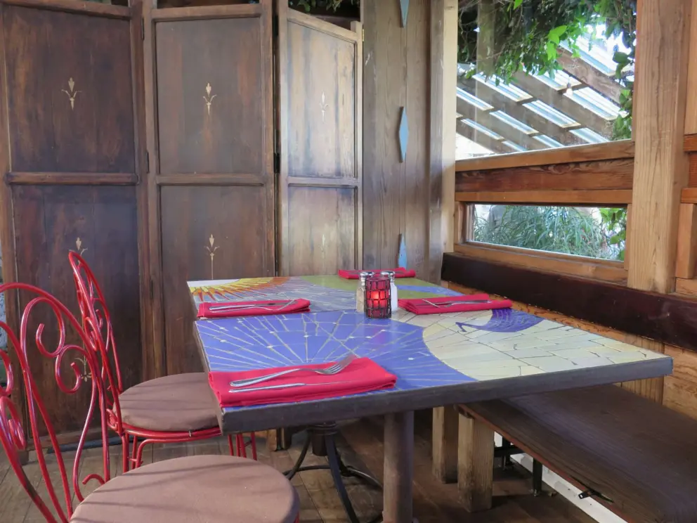 Inside Robin's Restaurant's upper garden room. I like the mosaic tabletops and the wood everywhere. 