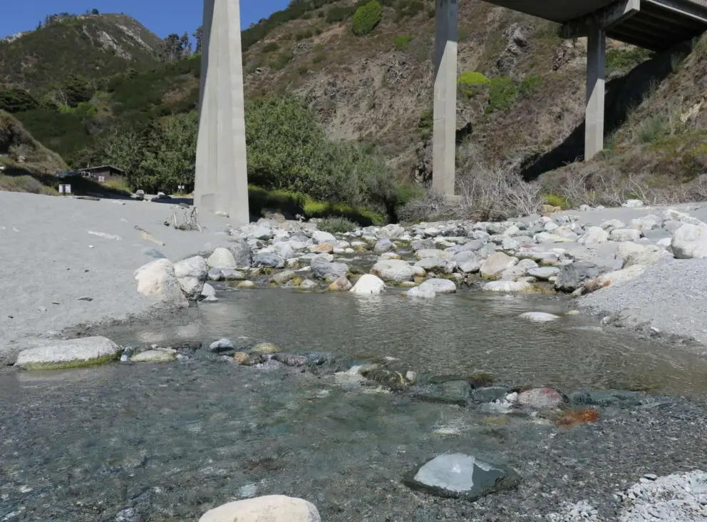 The clear river under the highway overpass at Limekiln State Park. 