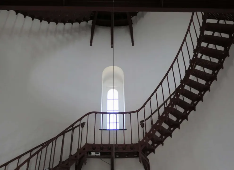 Inside the lighthouse, with its beautiful staircase and arched window!