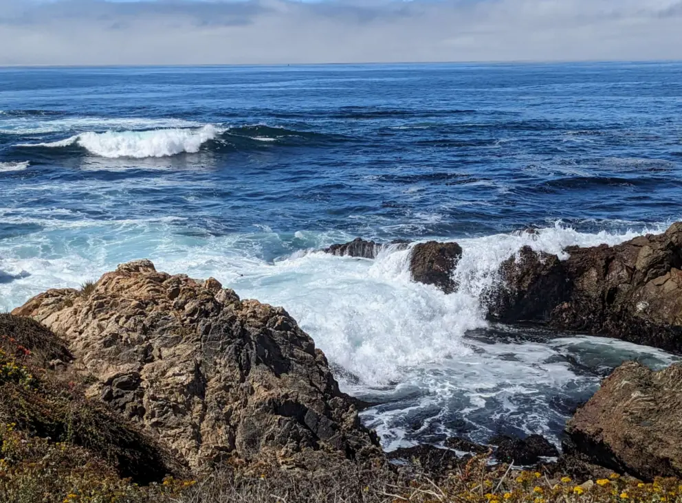 Waves crashing over rocks. 