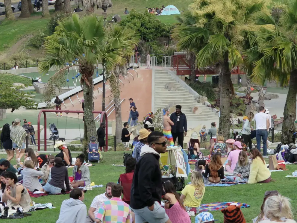 The playground is on a mound in the center of the park. 