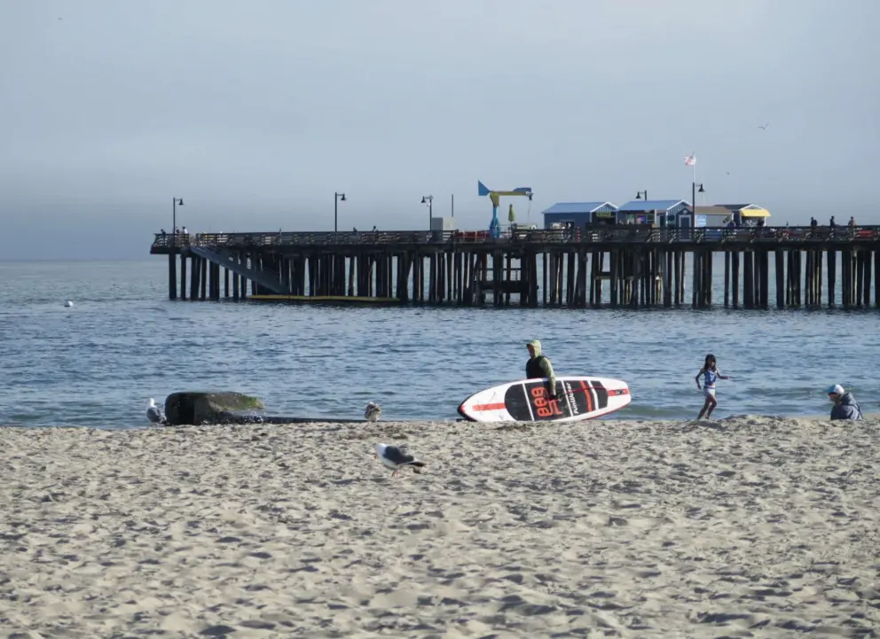 A paddleboarder at Capitola Beach. 