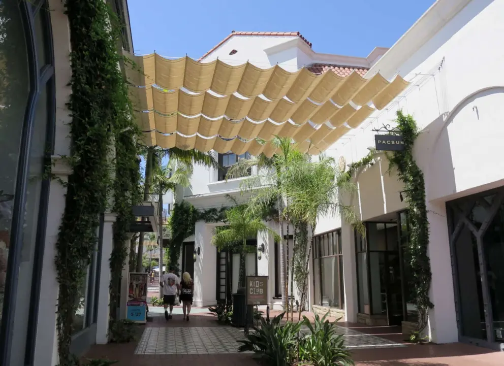 Shady walkway between stores. 