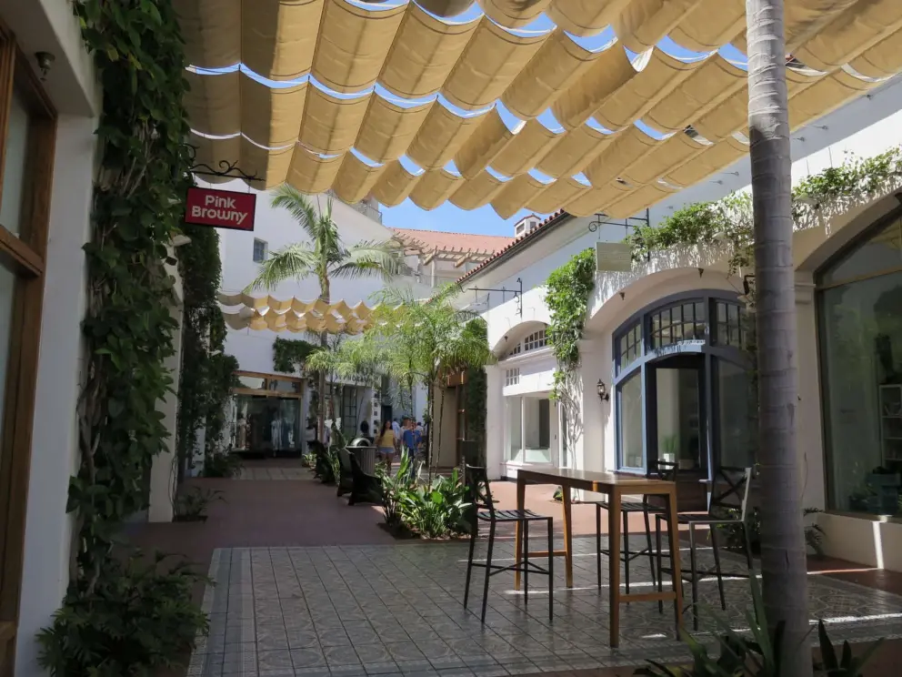 The shade awnings look beautiful with the blue sky peeking through.
