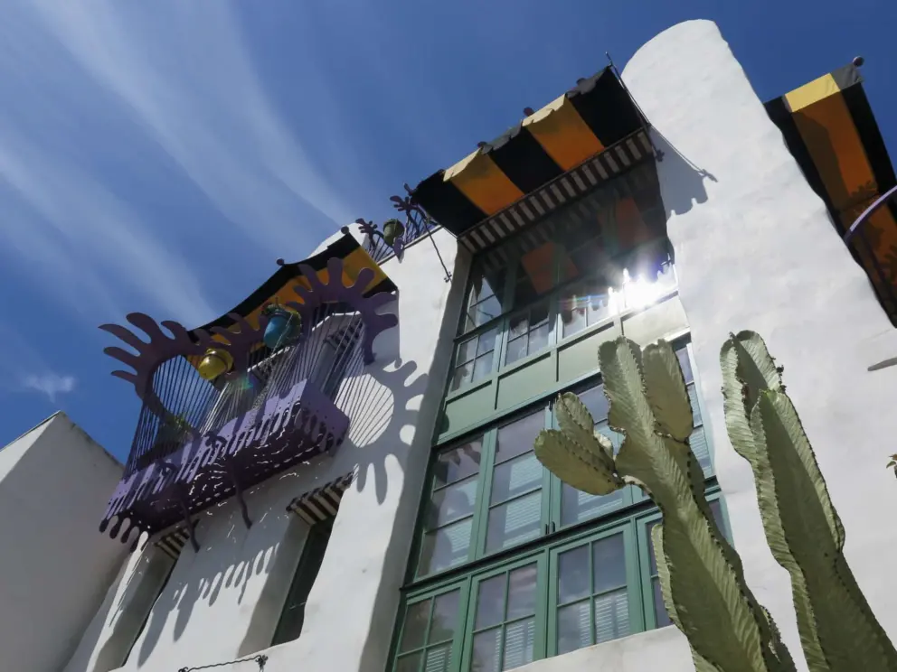 The yellow awnings and purple ironwork balcony of El Zapato.