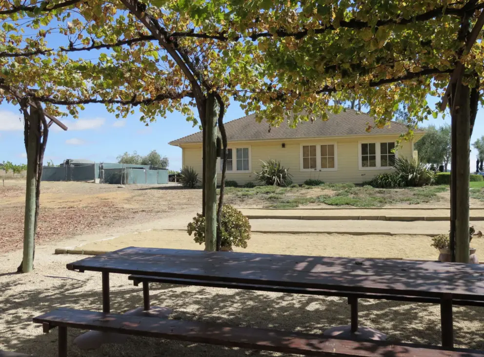 The yellow house, seen from the picnic tables. 