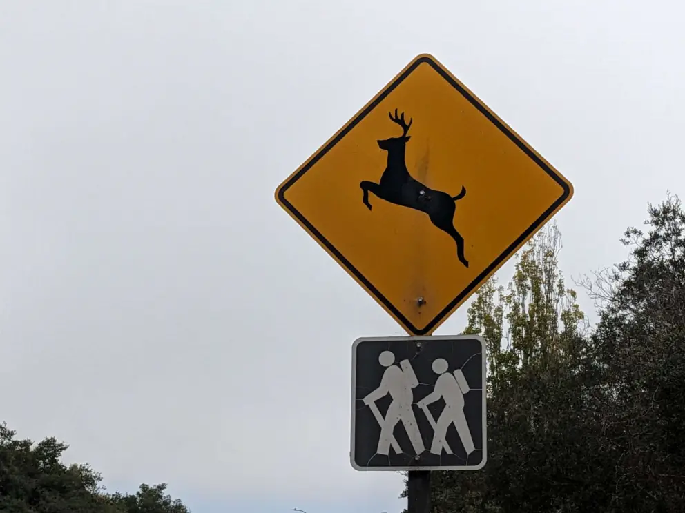 Deer and hiking signs. 