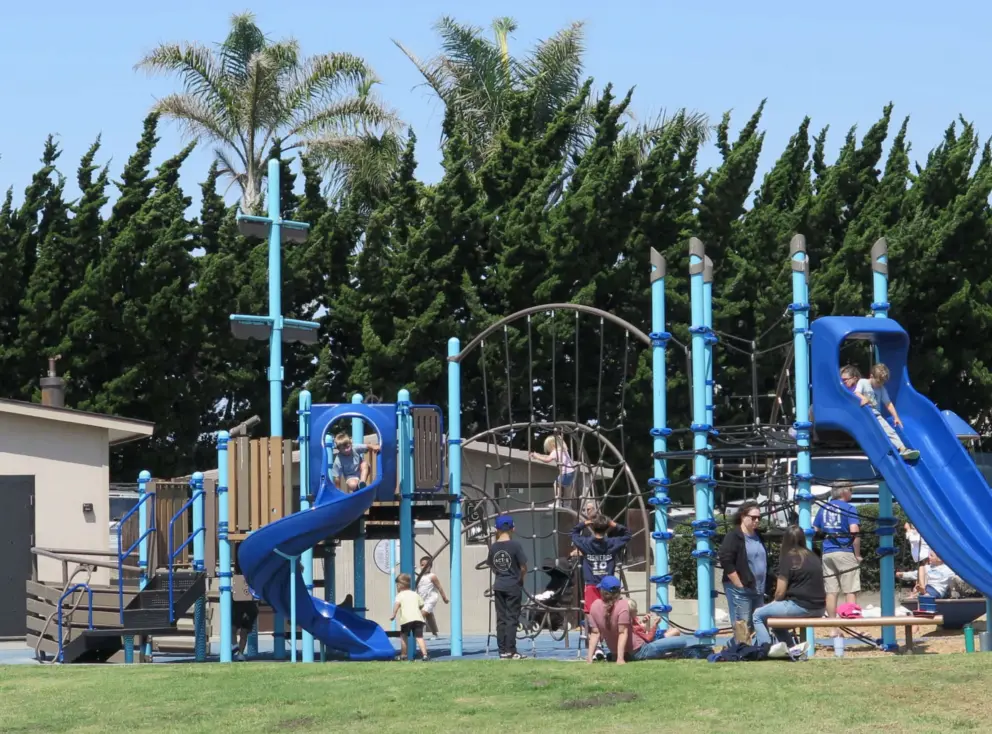 Busy summer day at the playground. 