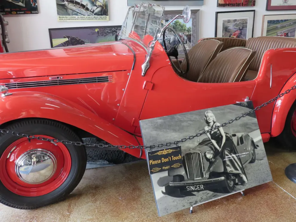 Nine Roadster, built by Singer Motors in England in 1957. Here, Marilyn Monroe poses in front of one. 