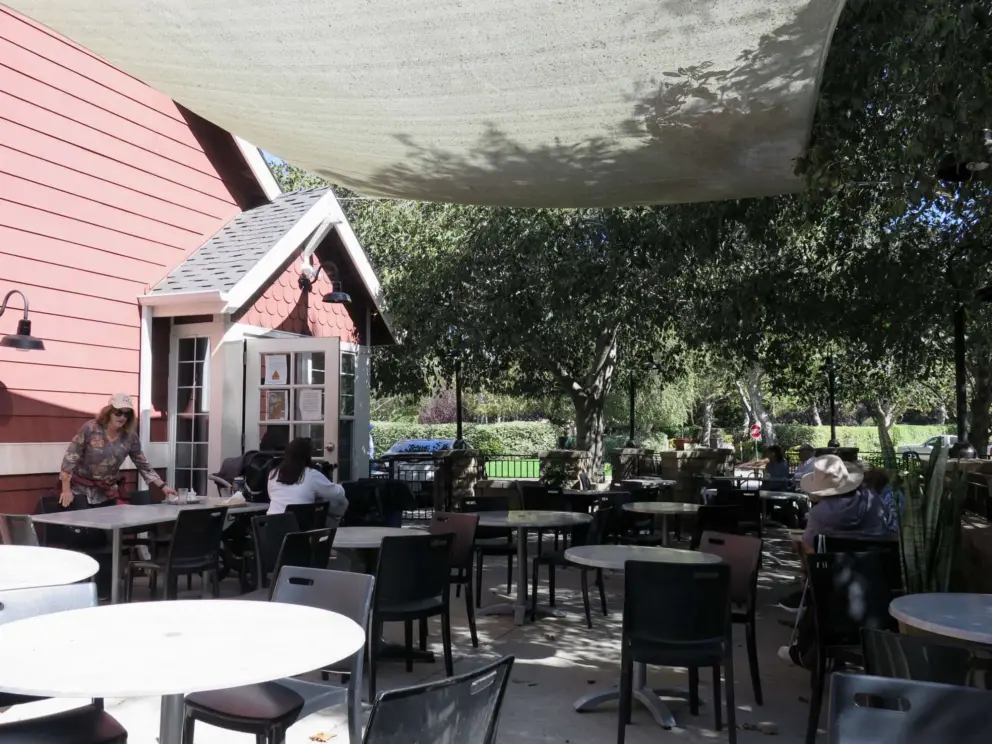 Woodstone Marketplace outdoor seating, at Avila Village, along the trail.