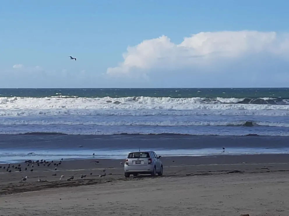 A car on the beach at the Grand Avenue end of the beach, on a very cold day. 