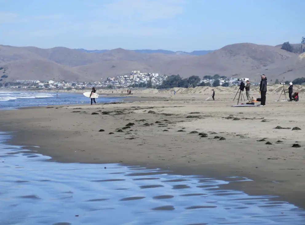Photographers gather on the beach at the SLO CAL Surf Contest. 