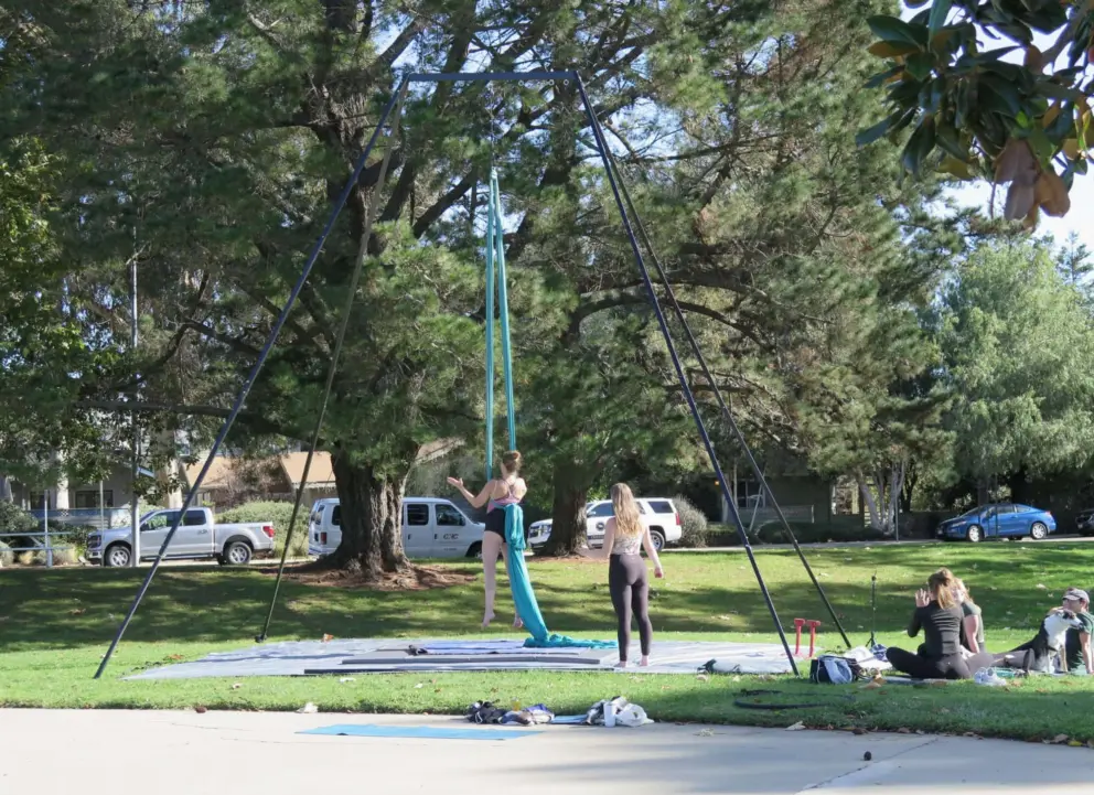 Group practising silks outside. 