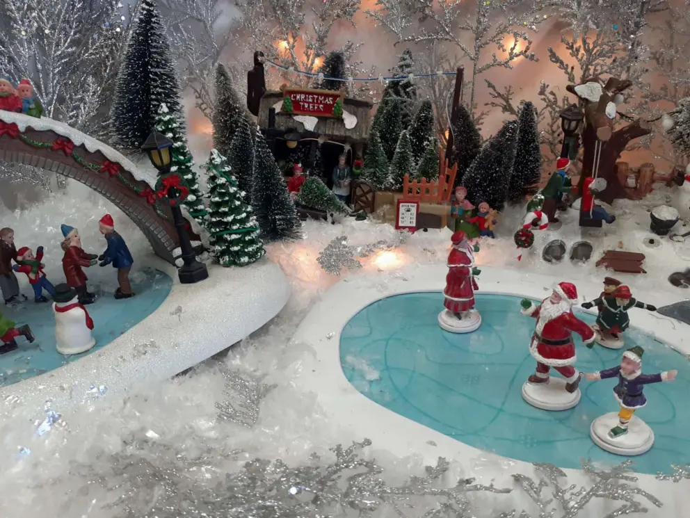 Ice skaters at the miniature Christmas village at El Sitio Cafe in December. A fun place to pick up a picnic burrito!